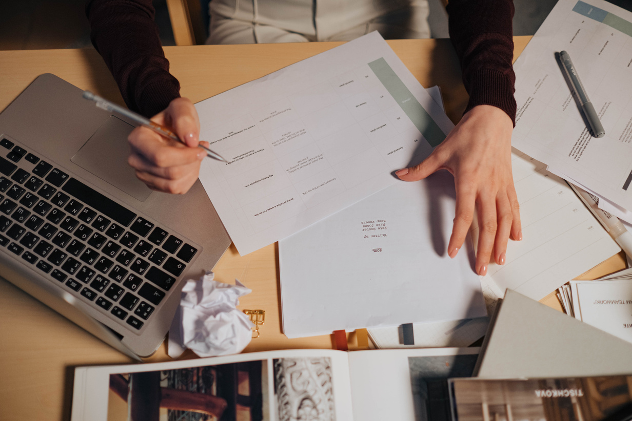 Person Holding White Document Paper